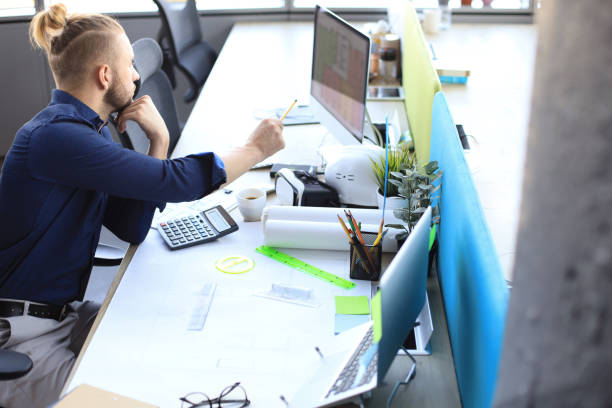 istock Shot of a handsome architect pondering over his design. 1168746924