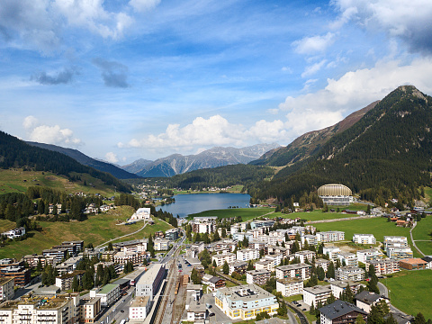 Aerial view of Davos city and lake. Davos is swiss city, famous location of annual meetings of World Economic Forum.