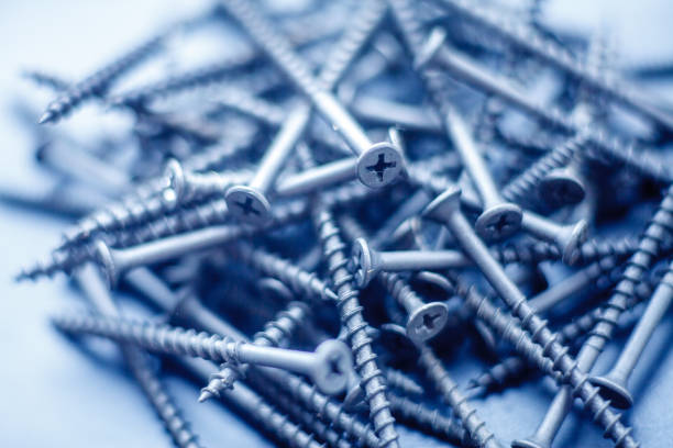 istock Steel tapping screws abstract background 1168747244