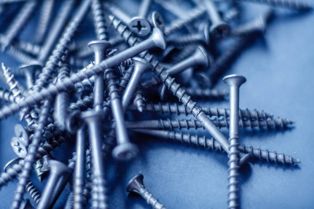istock Steel tapping screws abstract background 1168747257