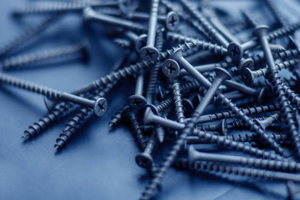 istock Steel tapping screws abstract background 1168747271
