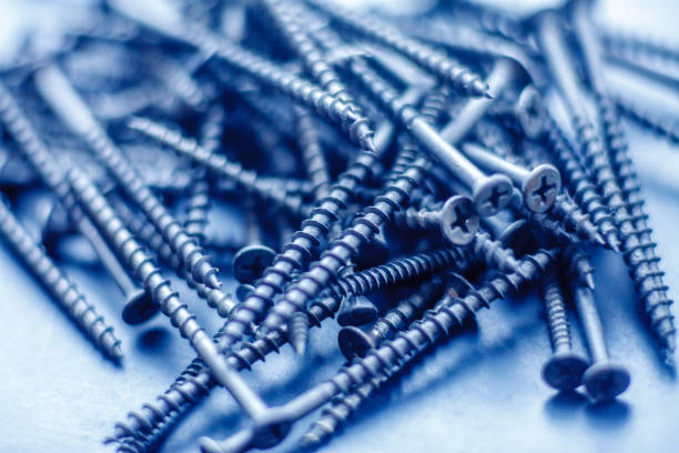 istock Steel tapping screws abstract background 1168747280