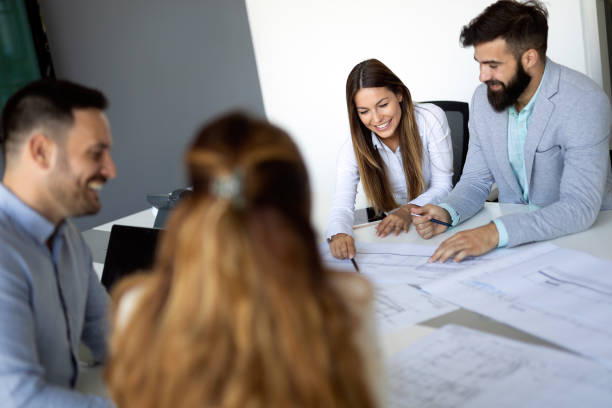 istock Group of coworkers working together on business project in modern office 1168748556