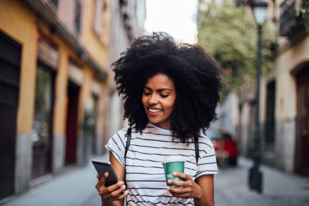 istock Beautiful girl using smartphone while waiting for the ride 1168749272