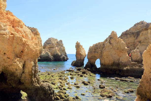 istock Rocky shoreline at Ponta Da Piedade surrounded by limestone cliffs 1168749548