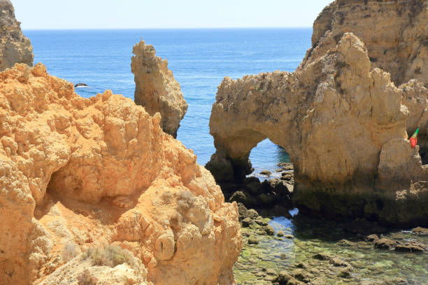 istock Jagged Limestone archways and pillars at the Ponta Da Piedade Headland 1168749701