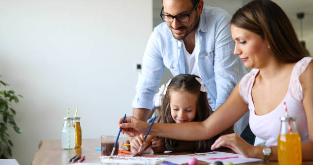 istock Happy familiy spending fun time at home 1168751276