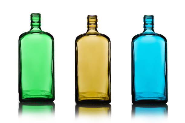 istock Three empty alcohol bottles of different color glass. 1168753802