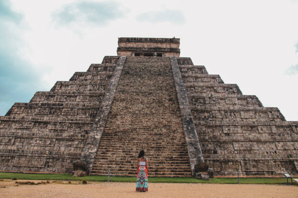 istock Girl standing at Kukulkan pyramid in Chichen Itza 1168754899