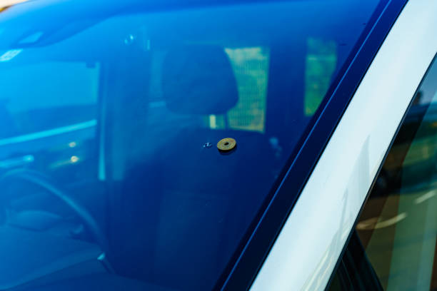 istock Accident of stone damage to the windshield while driving 1168754930