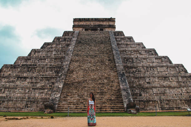 istock Girl standing at Kukulkan pyramid in Chichen Itza 1168755159