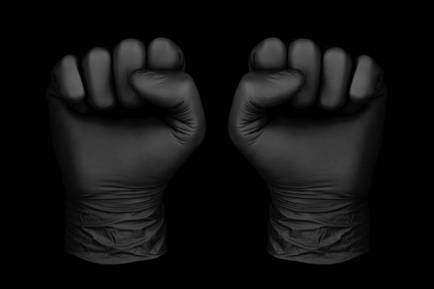 istock black glove on black background 1168757495