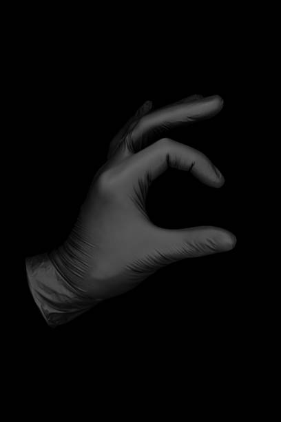 istock black glove on black background 1168757508