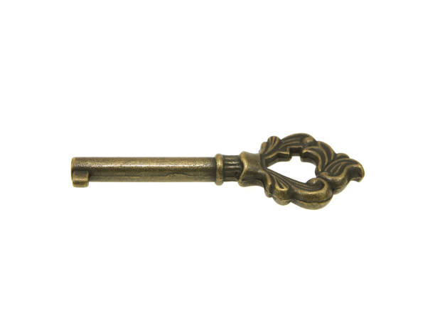 istock antique golden door key isolated on white background with clipping path. 1168758745
