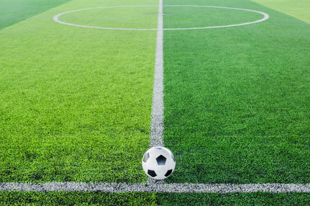 istock Soccer ball on artificial turf for green background. 1168759373