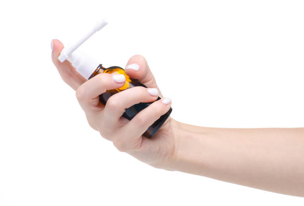 istock Throat spray medicine in hand 1168760939
