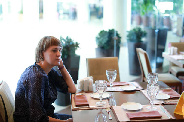 istock Thinking woman in restaurant 1168762057