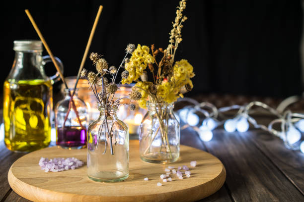 istock Decorative composition with aroma dried herbs in small glass bottles 1168762659