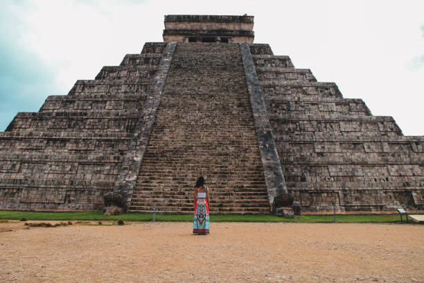 istock Girl standing at Kukulkan pyramid in Chichen Itza 1168762705