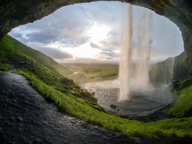 istock View of dusk from behind Seljalandsfoss 1168766793