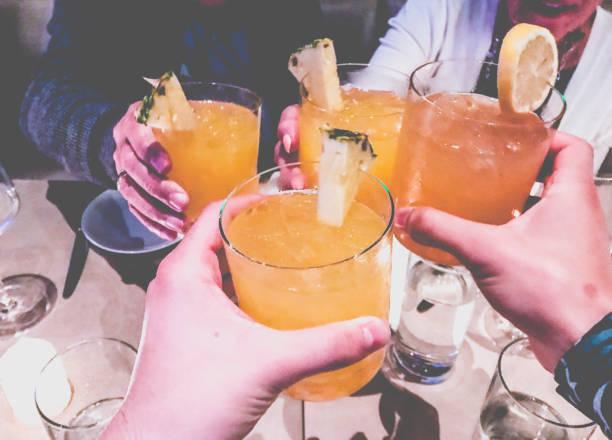Friends toasting with cocktails