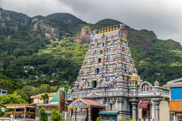 Hindu temple in Victoria, Seychelles Hindu temple with colorful facade called Arulmihu Navasakti Vinayagar Temple in Victoria on Seychelles island mahé with mountain range in the background mahe island stock pictures, royalty-free photos & images