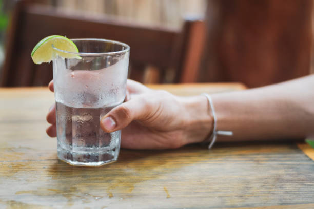 istock Male hand holding water glass 1168766969