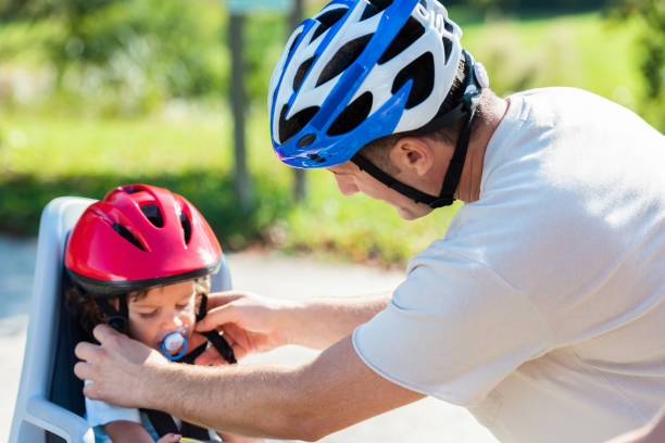 istock Father And Child On Bicycles In The Park 1168767011