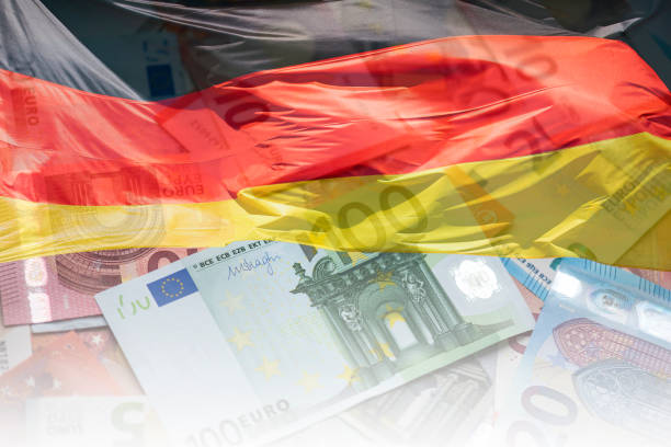 german flag and eu euro banknotes, flag of germany and euro money, concept picture - german countryside imagens e fotografias de stock