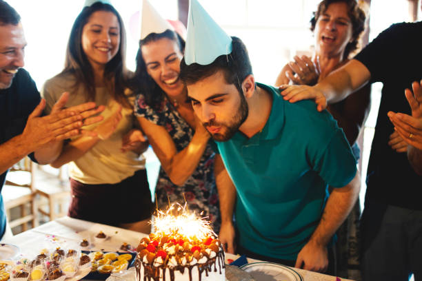 istock Family celebrating a birthday party, clapping and having fun 1168769595