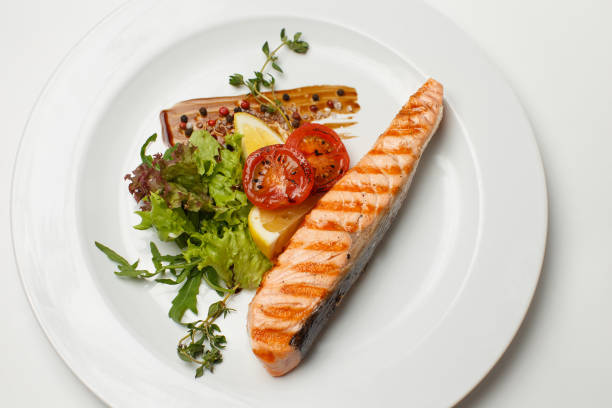 istock grilled salmon steak fresh vegetables 1168770129