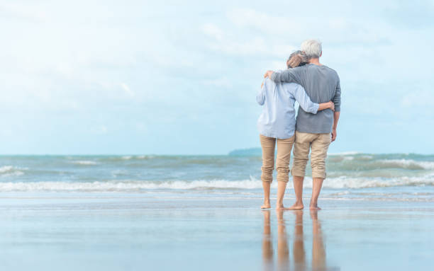 istock Beautiful happy elderly couple rest at tropical resort,back view 1168771664