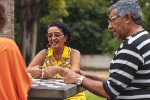 istock Brazilians playing domino in the public square 1168771896