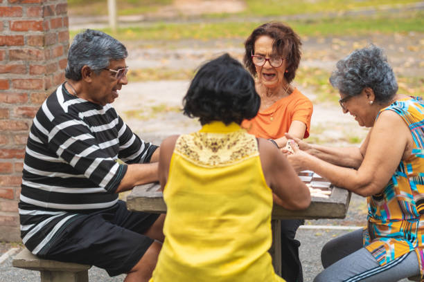 istock Brazilians playing domino in the public square 1168772056
