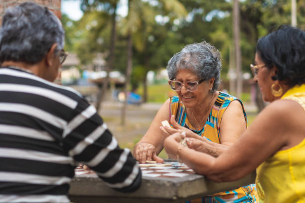 istock Brazilians playing domino in the public square 1168772214