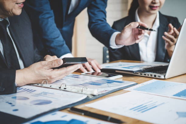 istock Executive team discussing the charts and graphs working in business strategy and financial plan to investment profit, discussing working analysis with financial data and marketing growth report 1168773037