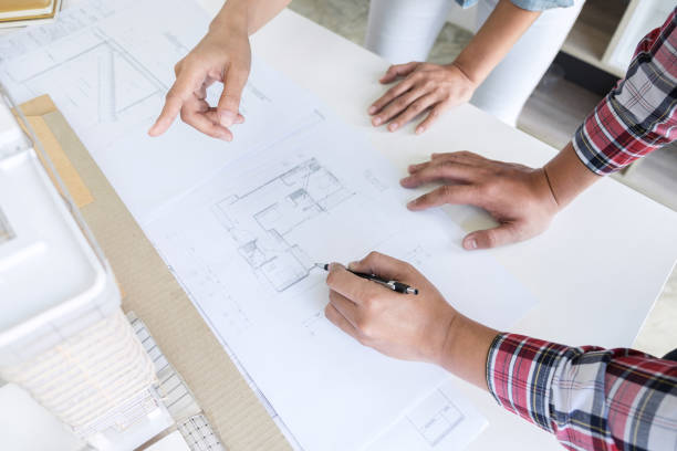istock Architect working on blueprint, Engineer meeting working with partner colleagues and engineering tools for architectural project, Construction concept 1168773097