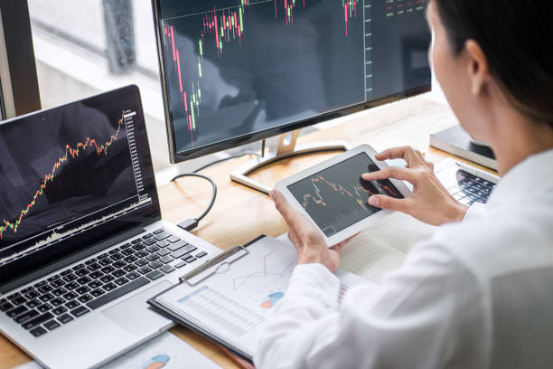 istock Businesswoman working with computer, laptop, thinking and analyzing graph stock market trading with stock chart data planning, financial and investment concept 1168773286