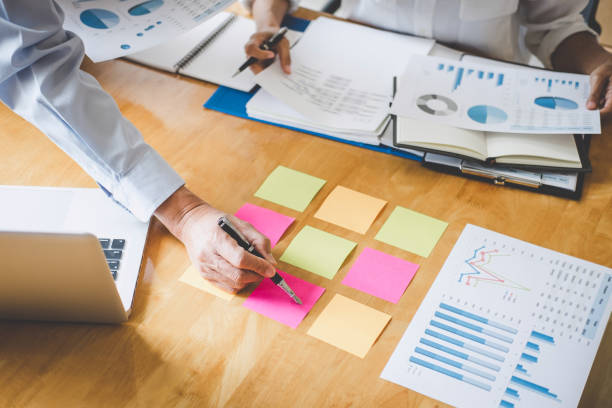 istock Co working conference, Business team meeting present discussing working analysis with financial data and marketing growth report graph in team, Finance, accounting, investment 1168773407