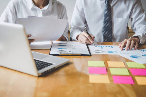 istock Co working conference, Business team meeting present discussing working analysis with financial data and marketing growth report graph in team, Finance, accounting, investment 1168773514