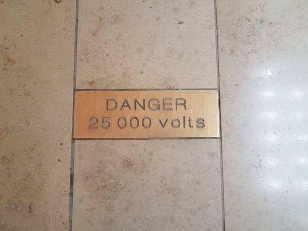 istock danger 25000 volts warning sign on tile floor 1168774605