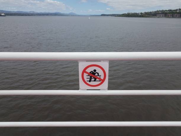 istock do not climb railing sign on ferry in Quebec, Canada 1168774606