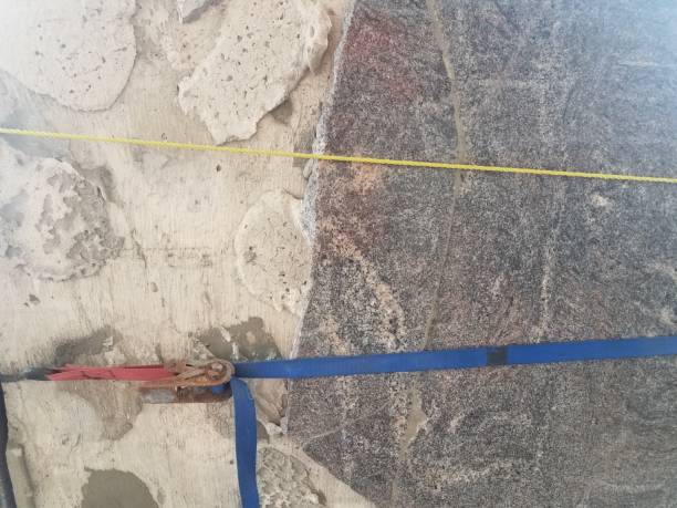 istock damaged or worn stone or cement pillar or column with rope 1168775207
