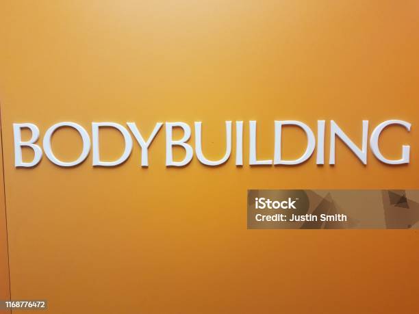 Body Building Text White Bodybuilding Text On Orange Wall Or Surface Stock Photo ...