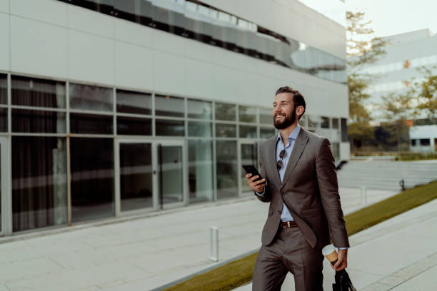 istock Business Executive Smartly Dressed With Mobile Phone 1168777846