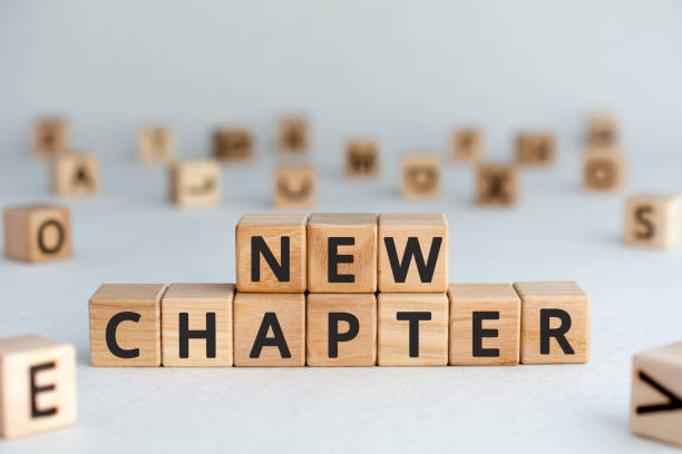 istock new chapter - words from wooden blocks with letters 1168780079