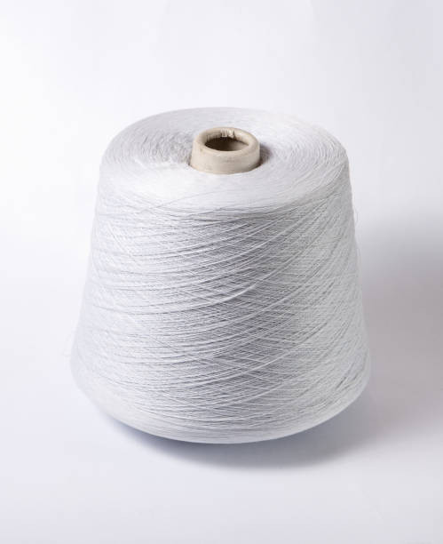 istock bobbin of yarn on a white background. Side view.Textile reel on isolated white background. 1168780163