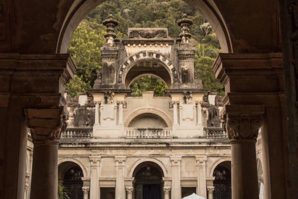 Weathered colonial architecture of the public Parque Lage, built in the 1920s, reflects the jungle forest of the surrounding Tijuca National Park. Rio de Janeiro, Brazil - August 17, 2019: Weathered colonial architecture of the public Parque Lage, built in the 1920s, reflects the jungle forest of the surrounding Tijuca National Park. floresta stock pictures, royalty-free photos & images
