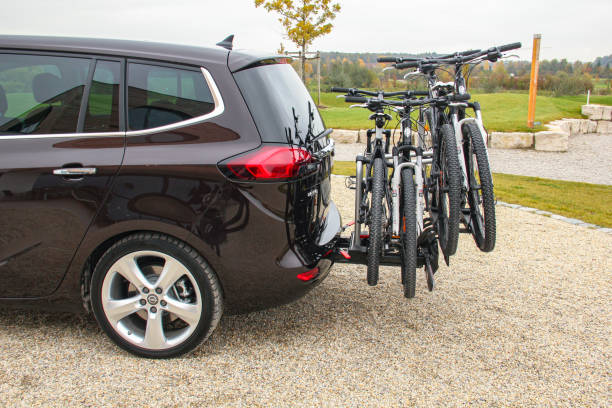 Foldable rear bike holder in a car Munich, Germany - 27th October, 2011: Foldable rear bike holder on the back of the Opel Zafira Tourer minivan. This bike rack can hold four bikes. bicycle rack photos stock pictures, royalty-free photos & images