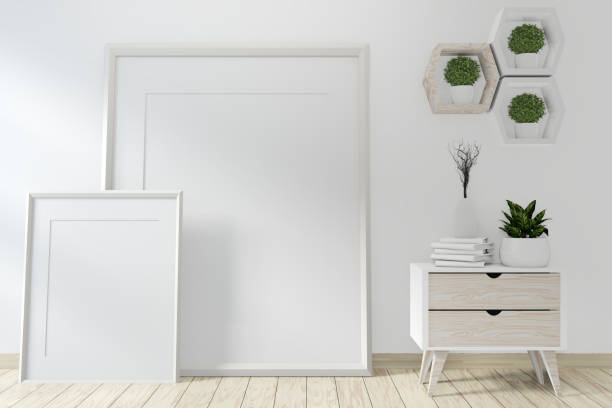 istock Mock up poster frame room with sofa green and decoration plants.3D rendering 1168781694